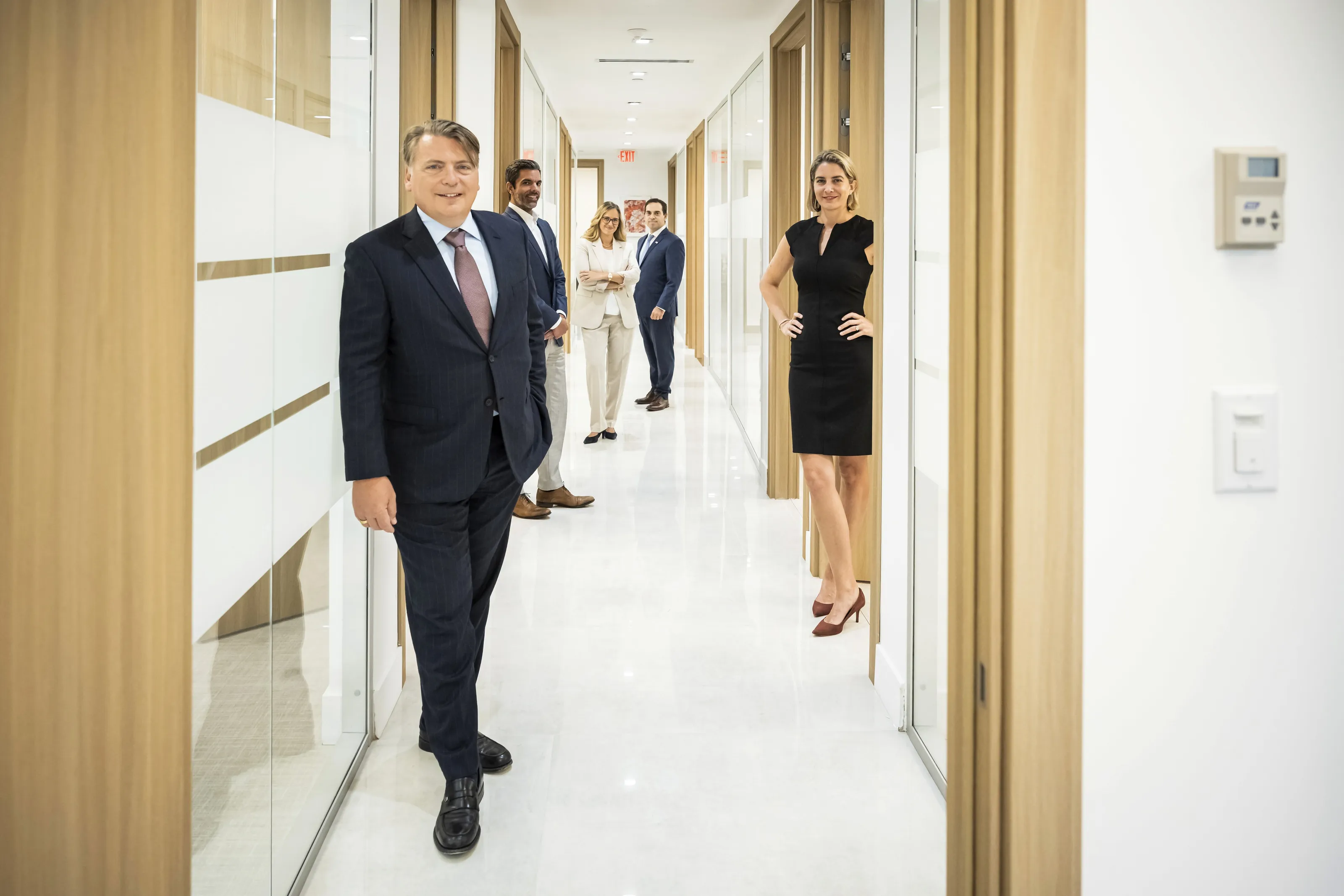 NEXT Legal partners in the hallway of the firm's Miami office