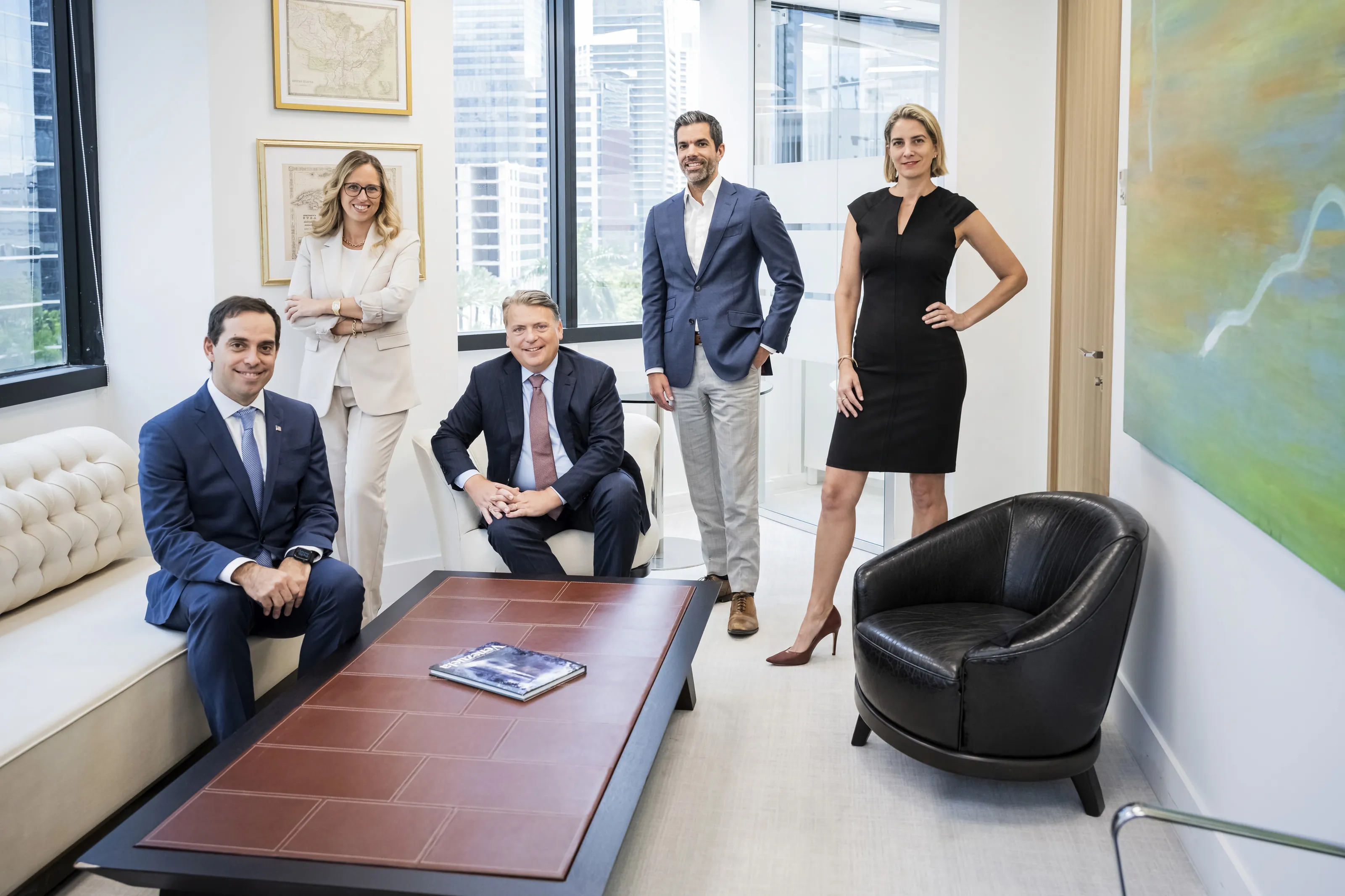 NEXT Legal partners and associates in a conference lounge overlooking Brickell